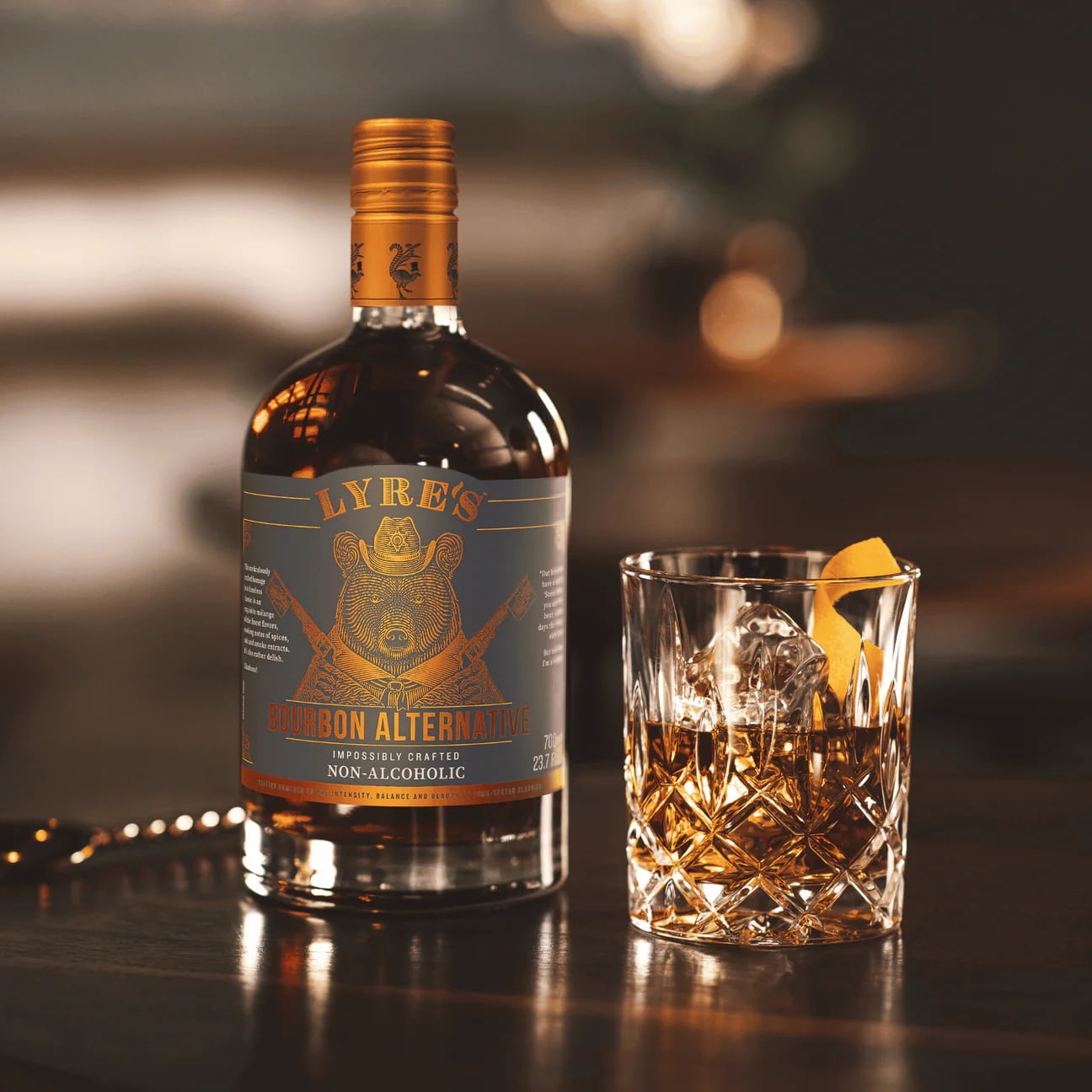 Bottle of Lyre's Non-Alcoholic Whiskey with a glass on a bar counter