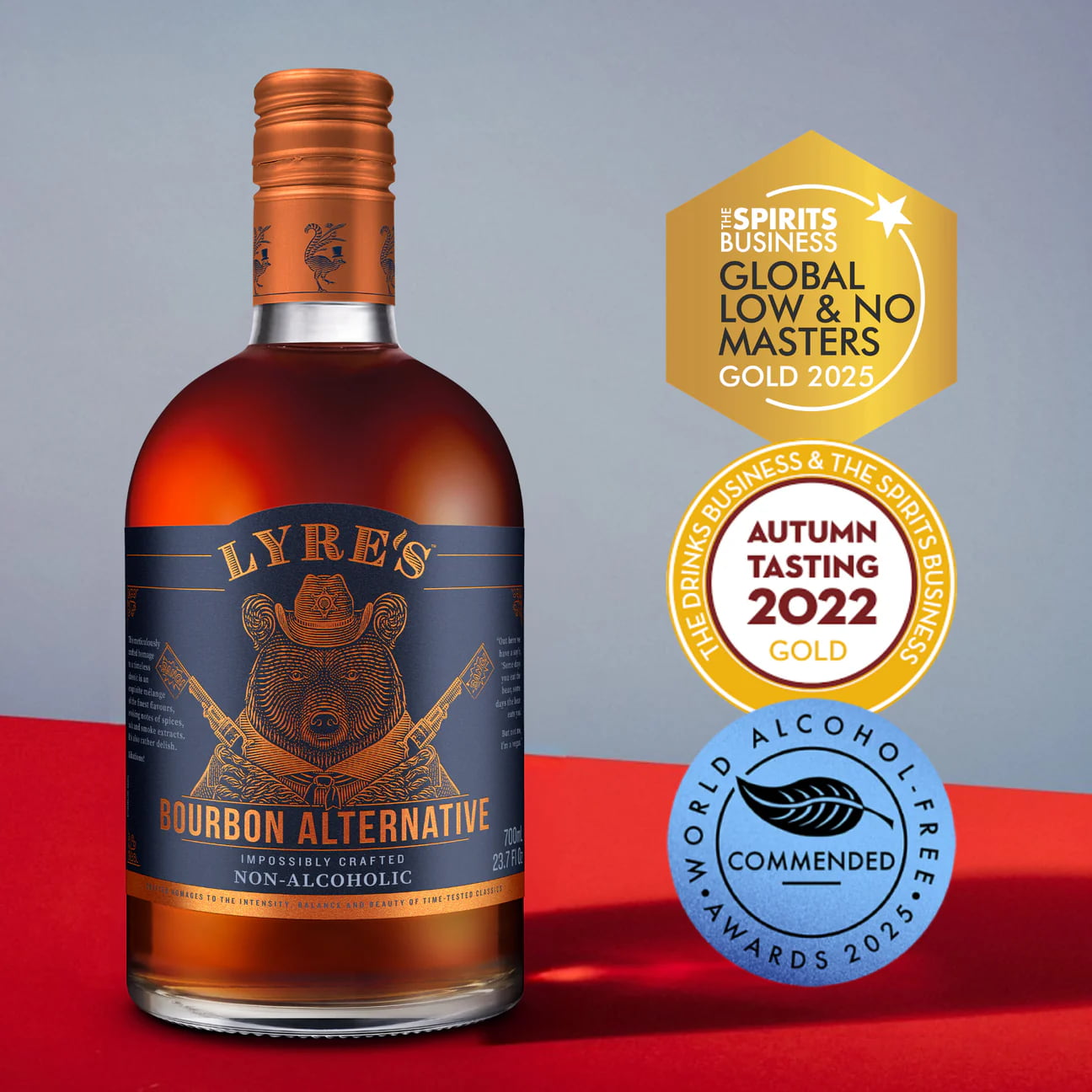 Bottle of Lyre's Bourbon Alternative with awards on a red and gray background